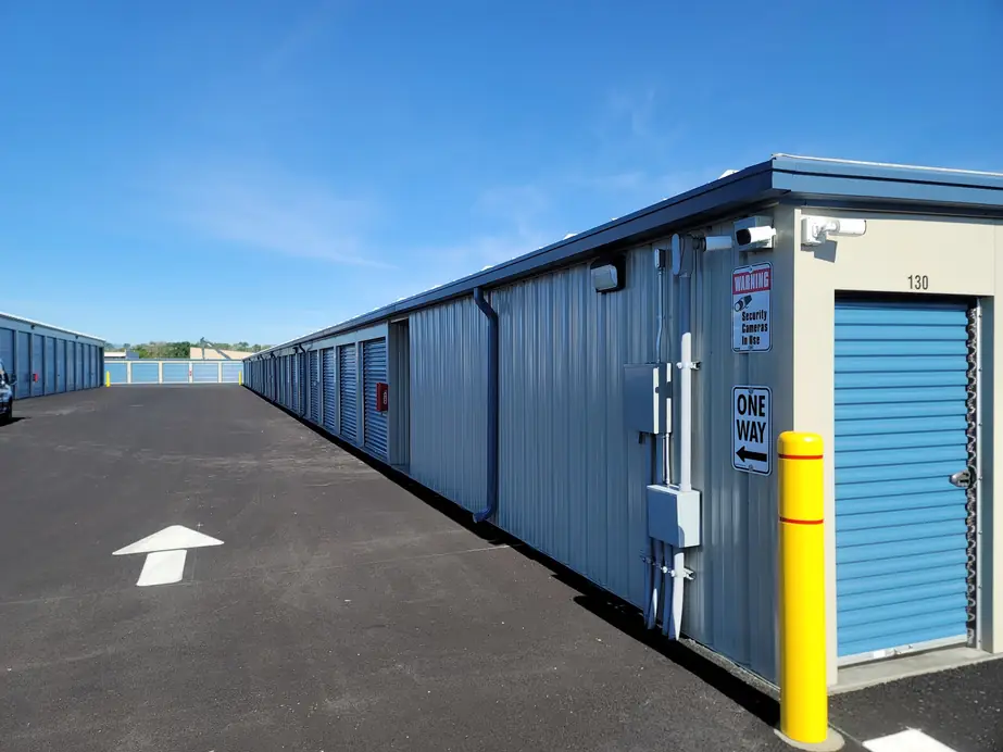 Rows of new storage units with exterior conduit and lighting at The Heights Self Storage