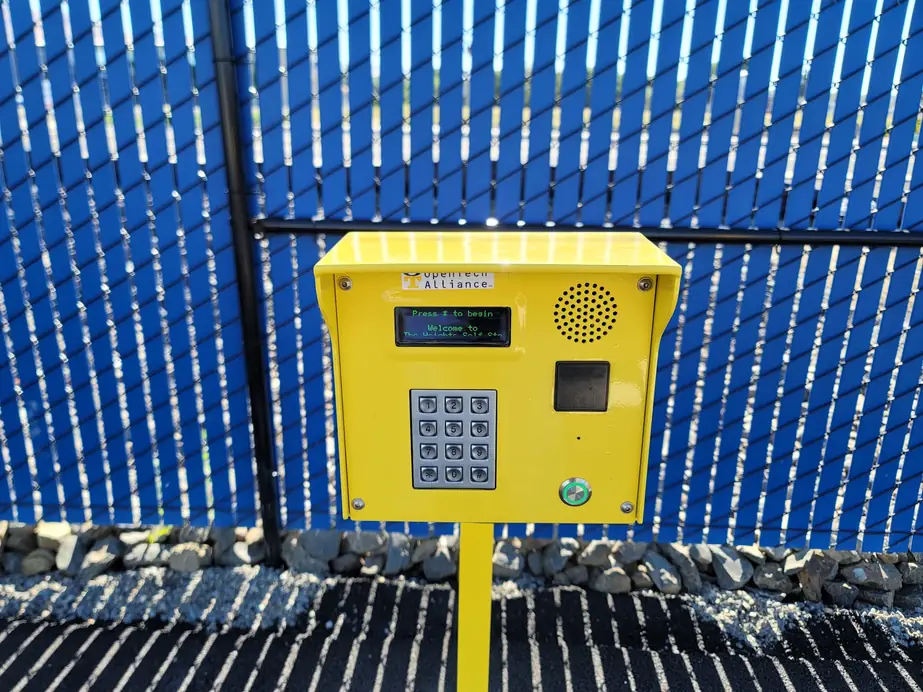 Yellow gate keypad and intercom post at The Heights Self Storage